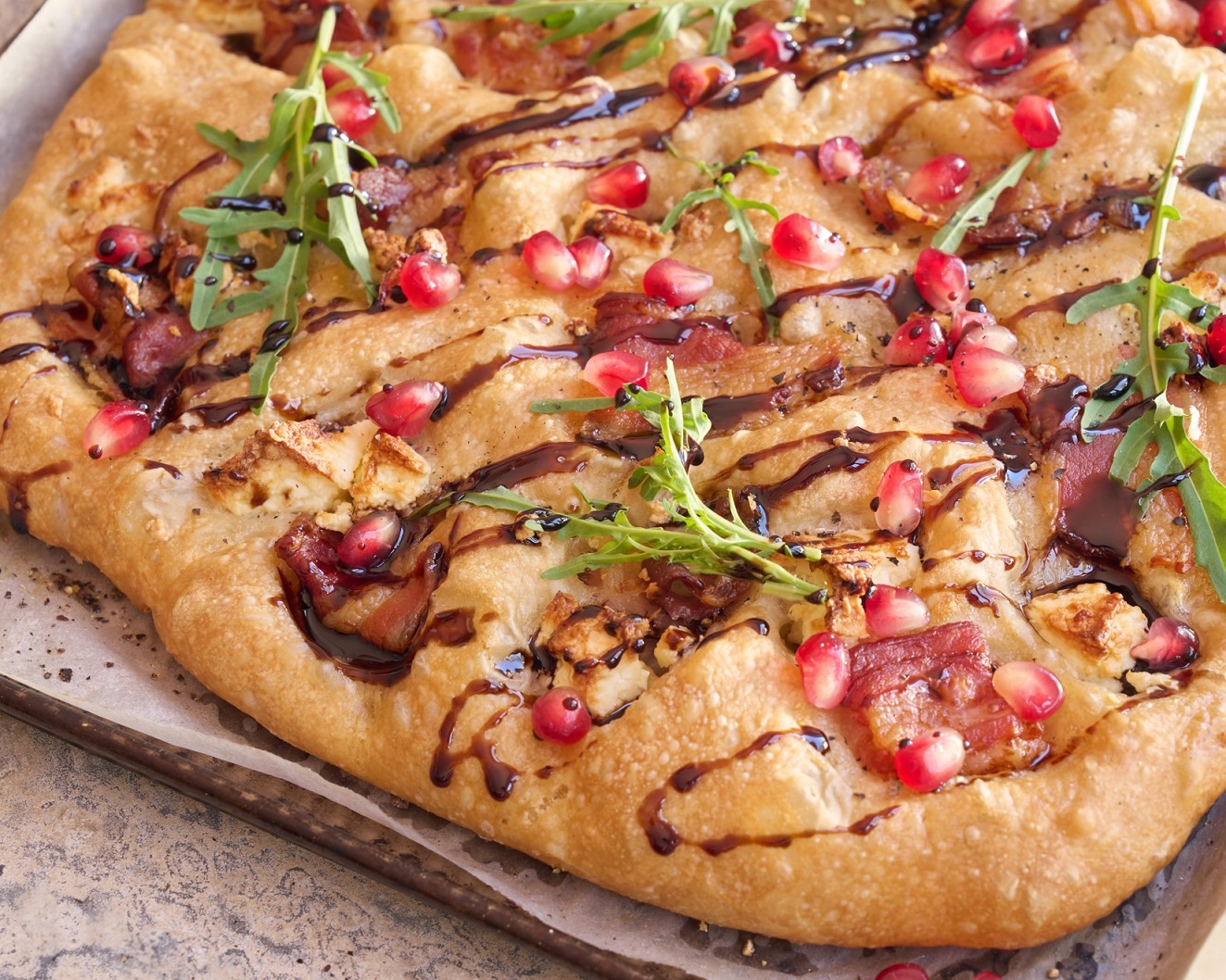Homemade bacon & feta focaccia with pomegranate arils & a balsamic glaze Homemade bacon & feta focaccia with pomegranate arils & a balsamic glaze